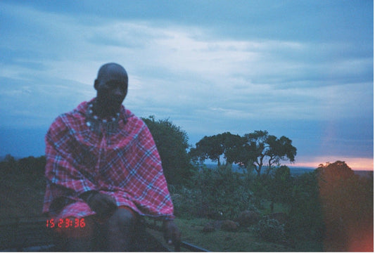 A Kenyan man  on the plains of the Mara Triangle in Kenya