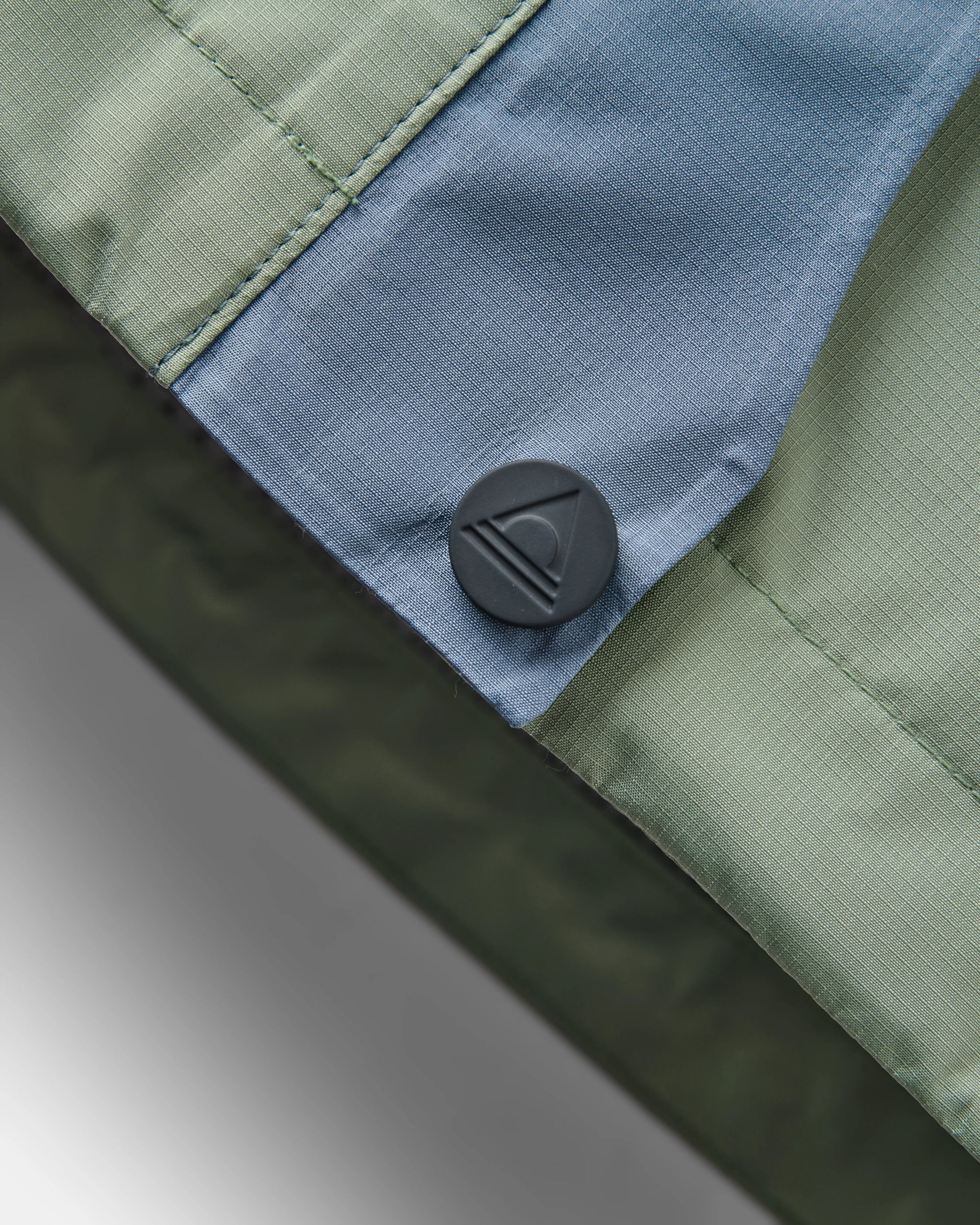 Trailscape Women's Waterproof Jacket - Stormy Blue/Pistachio - Flatlay