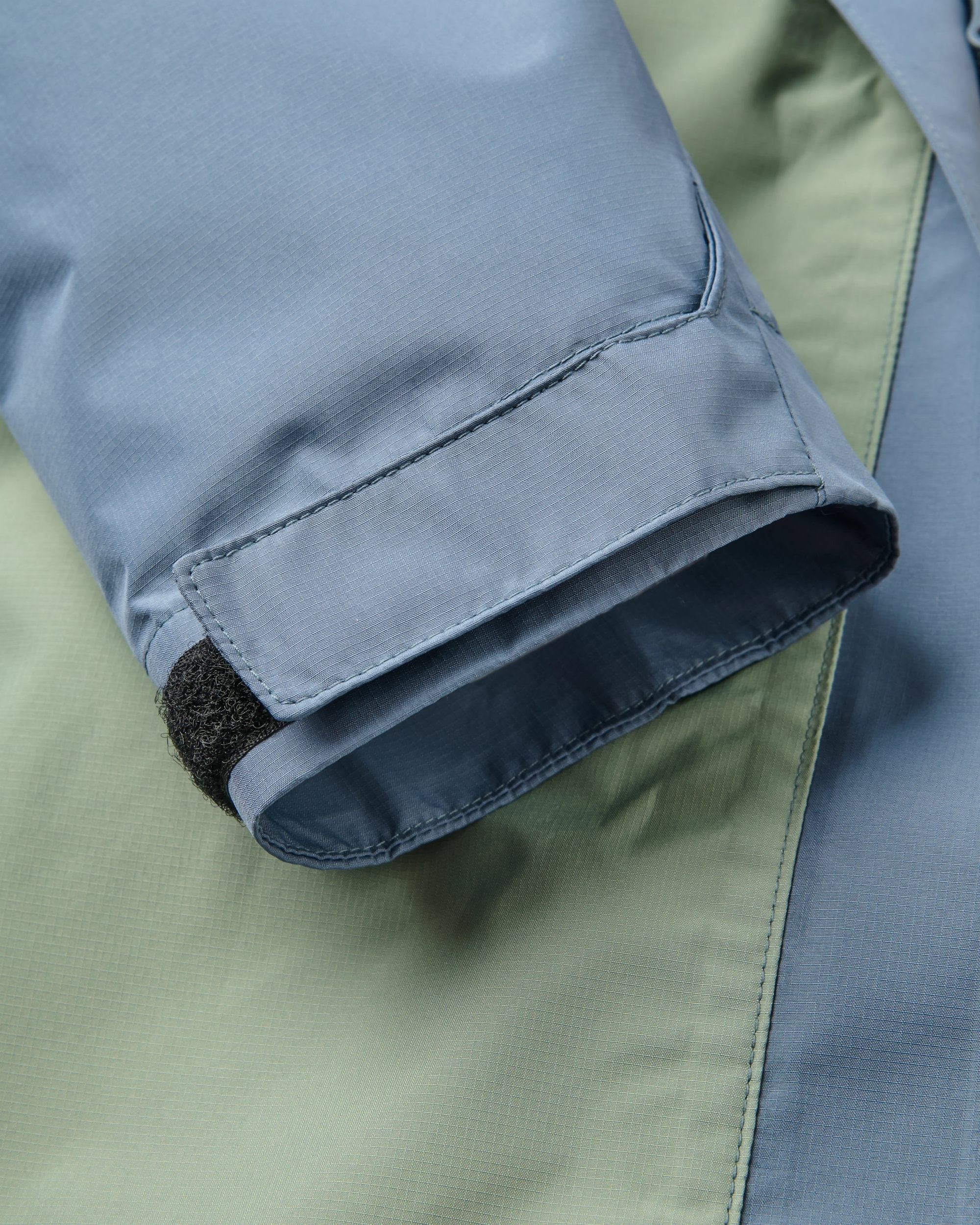 Trailscape Women's Waterproof Jacket - Stormy Blue/Pistachio - Flatlay