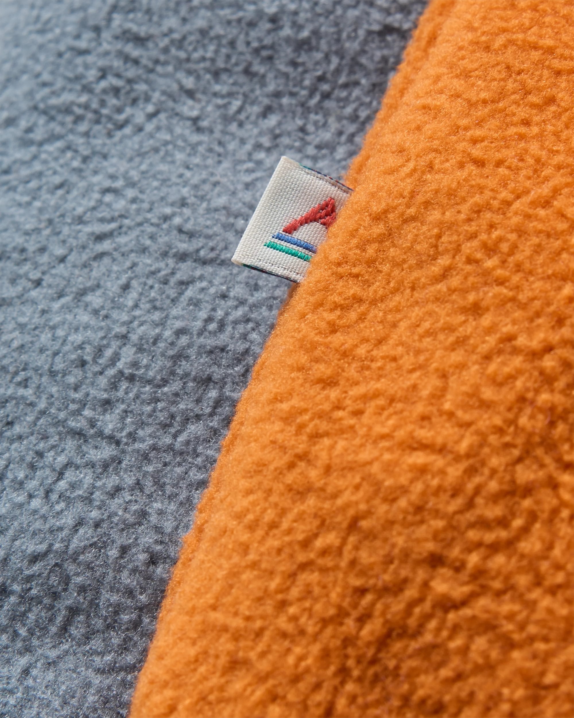 Set Off Recycled Polar Fleece - Sunset Orange/Storm Grey - Flatlay